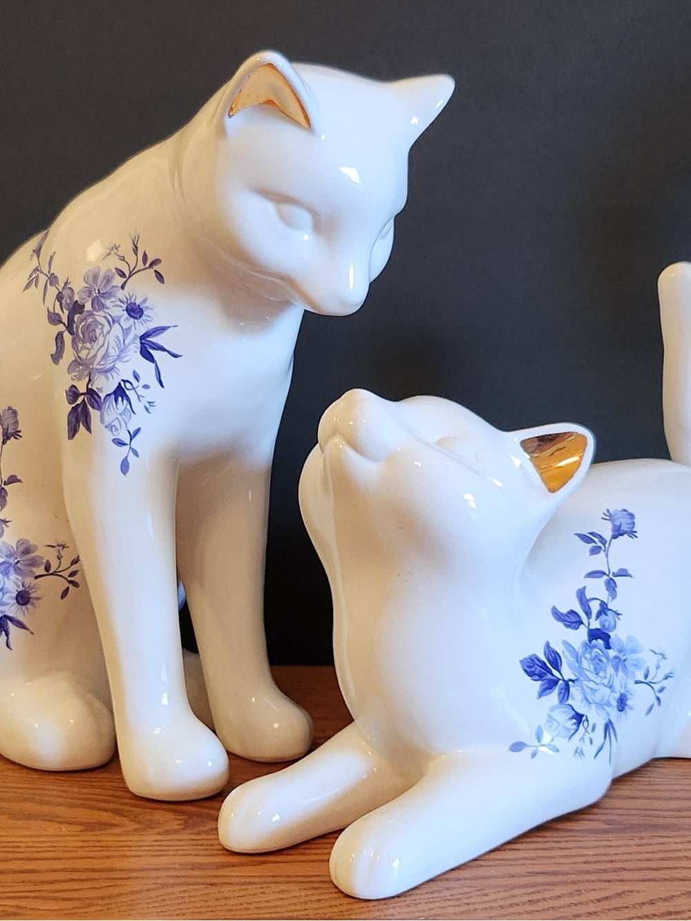 Pair Large White Ceramic Cats Blue Floral Accent Gold Ears 14” long 12” tall